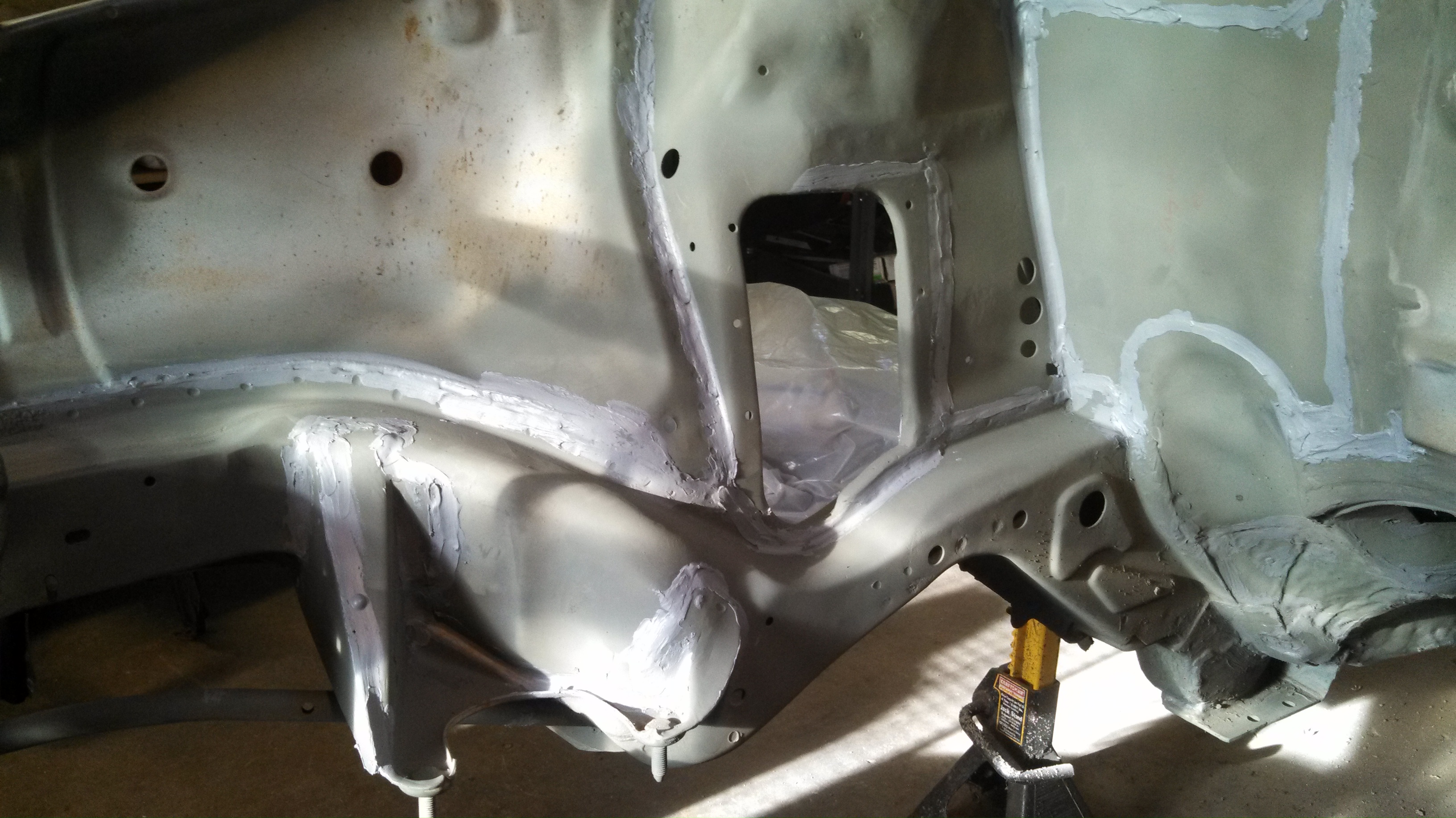 steering arm holes welded and sealed.jpg