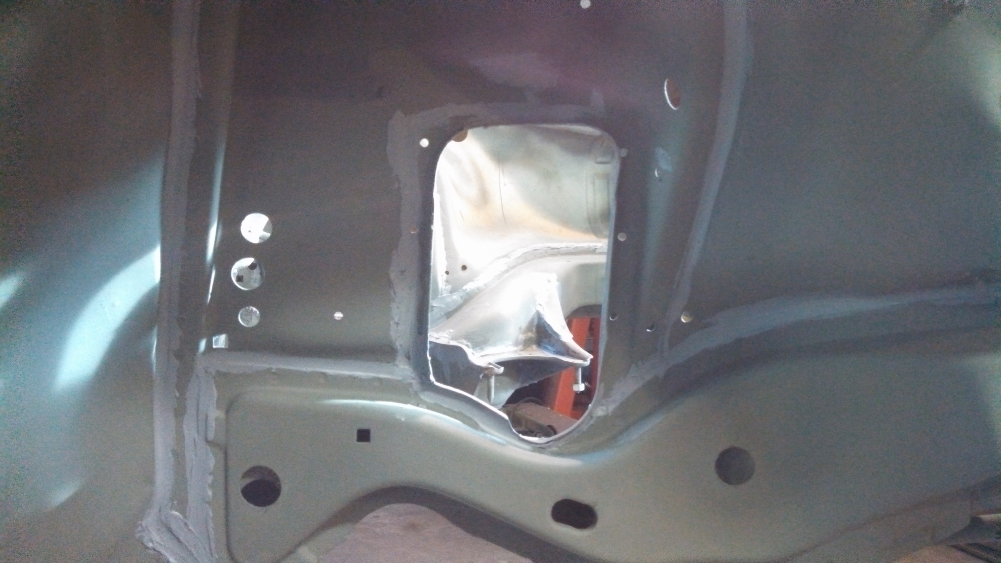 steering arm holes welded and sealed2.jpg
