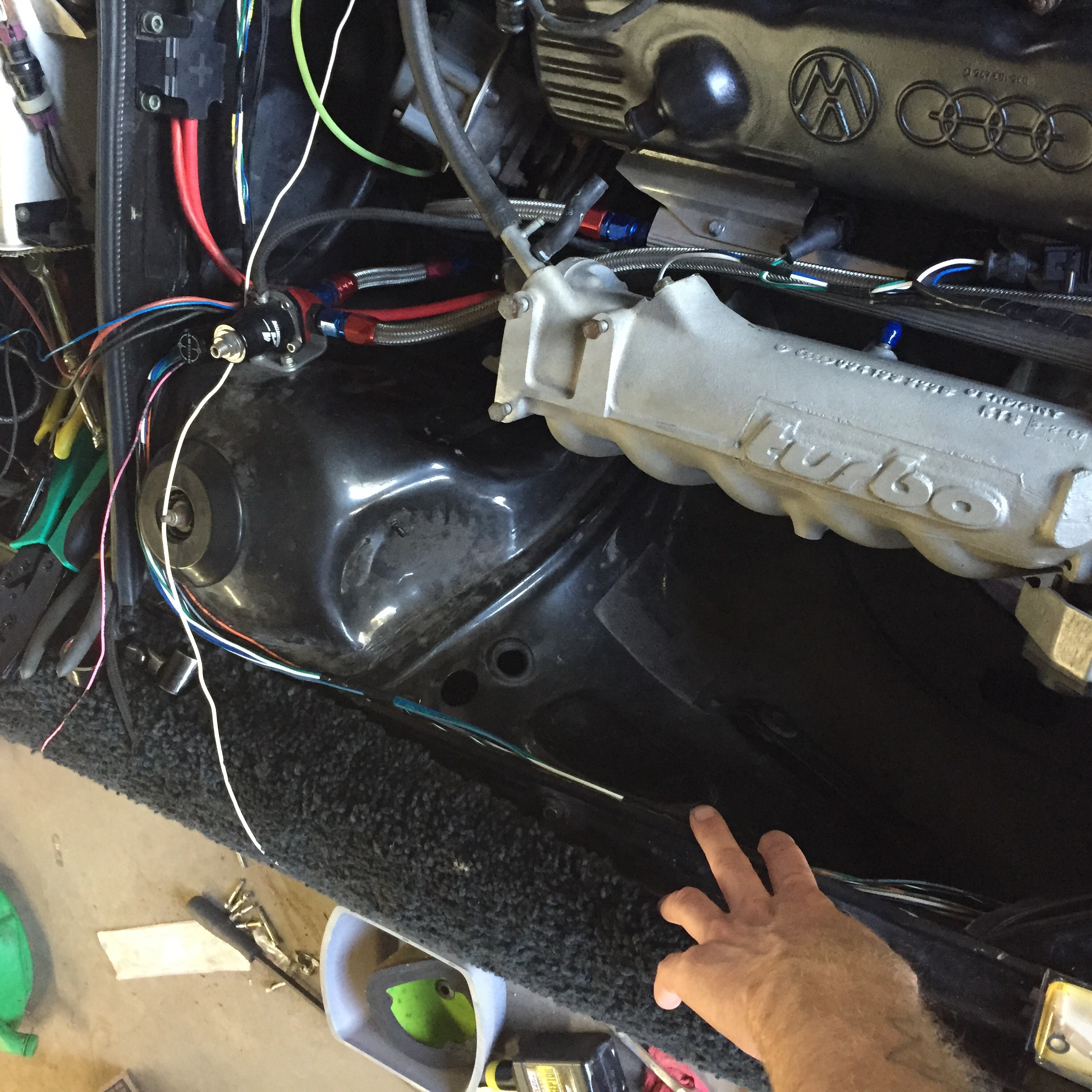 Eventually tucked up under the fender.